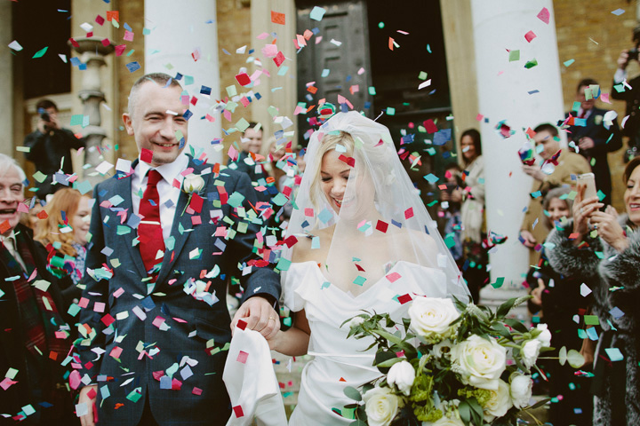 Bride and groom covered in confetti at a Winter wedding at Asylum chapel 