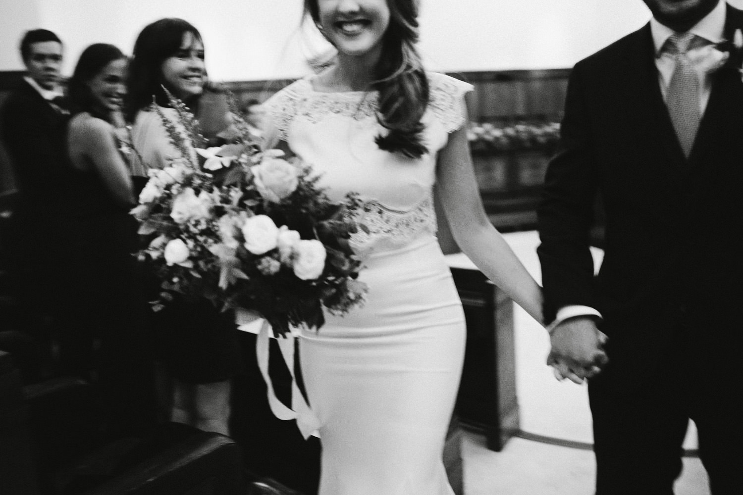 bride and groom leave the ceremony at the Townhall hotel in London