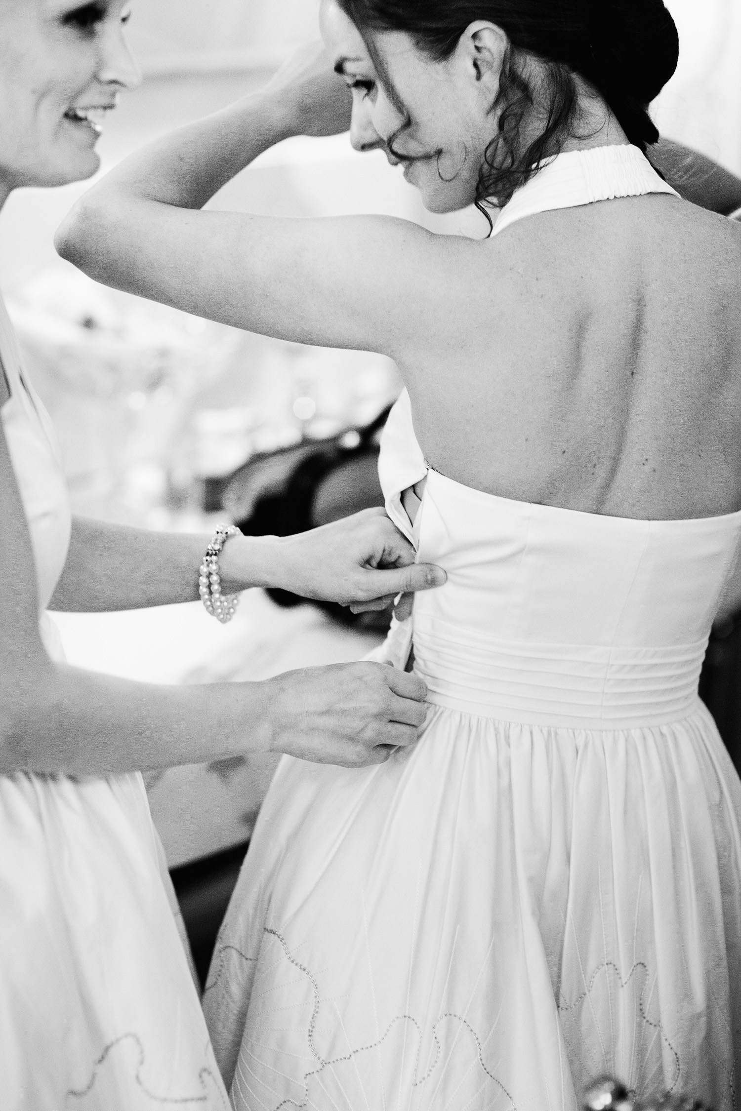 bridesmaids adjusting dresses