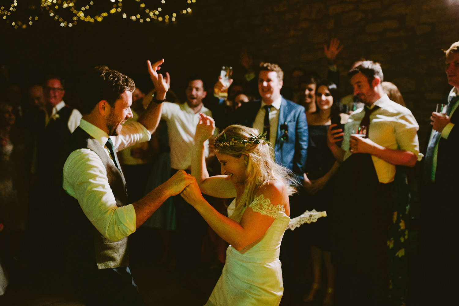 bride dances with groom in her Hermione de Paula wedding dress