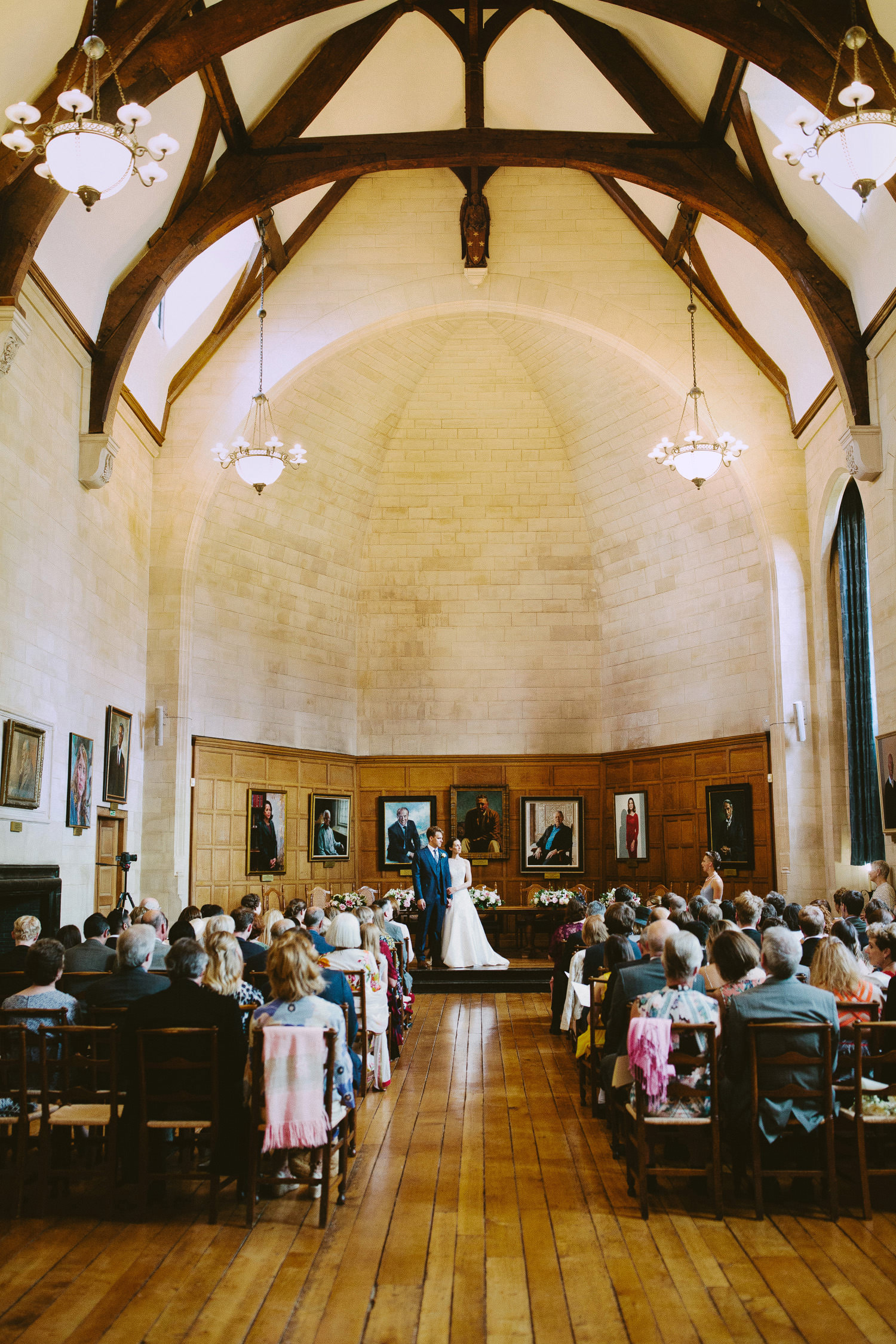 wedding service in a grand room at Rhodes House in Oxford
