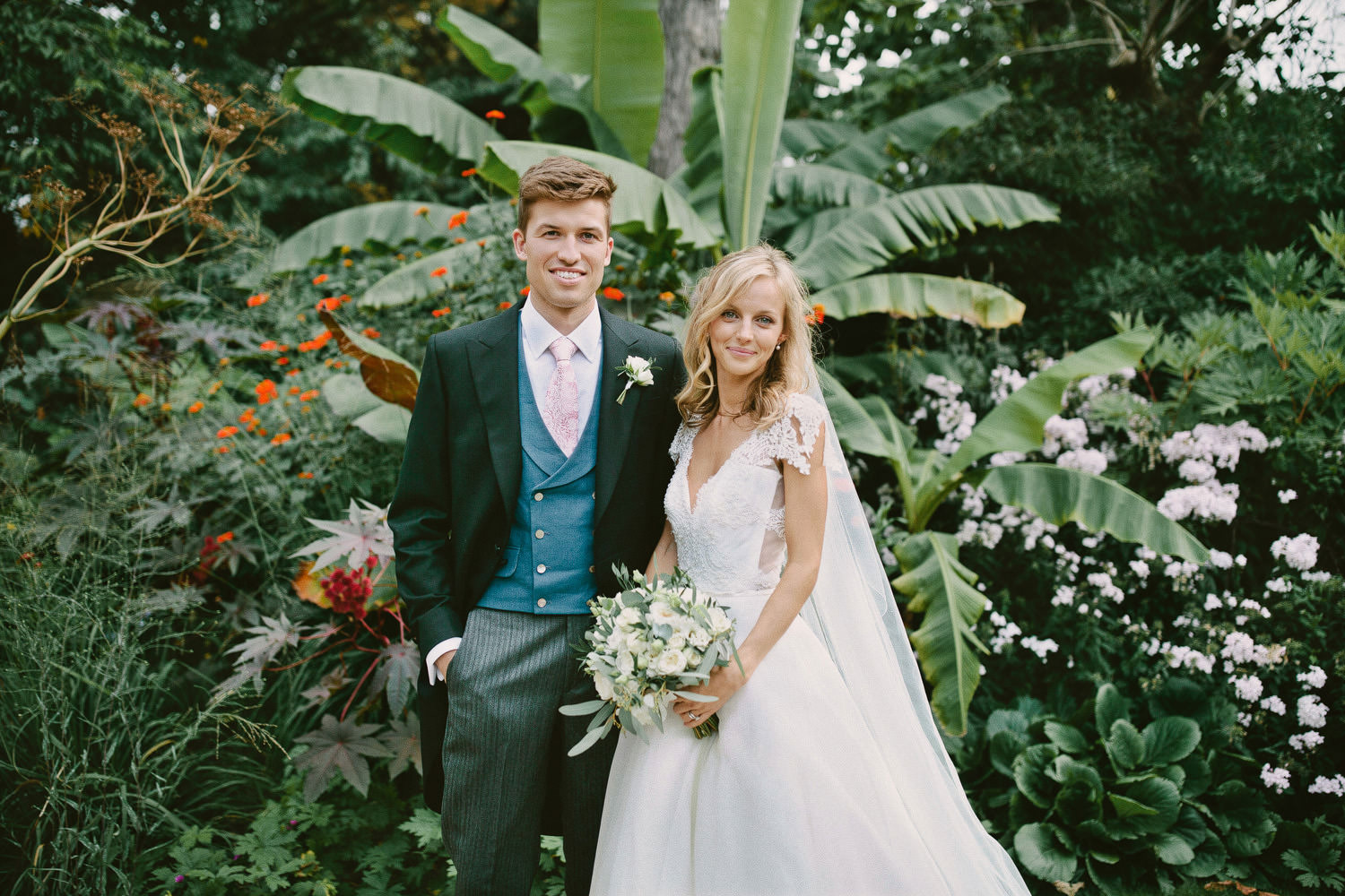 Bride and groom smiling at camera during oxford wedding