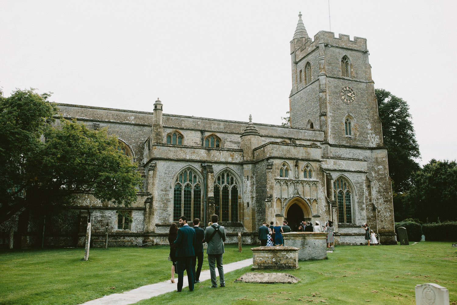 wedding guests arriving at church