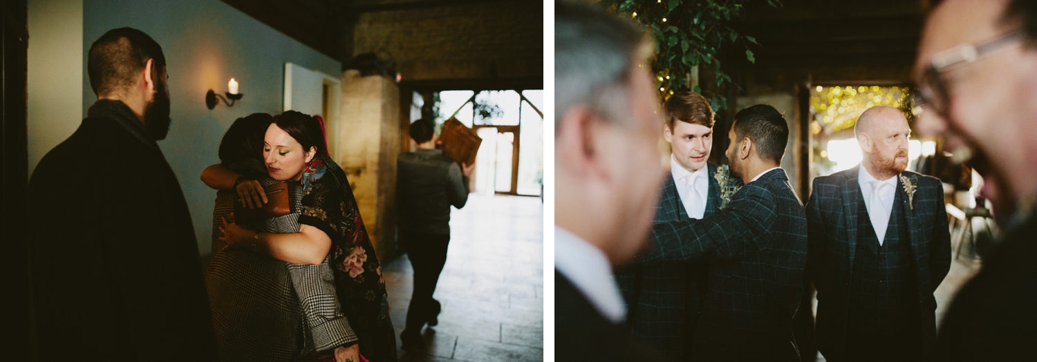 guests hugging at stone barn