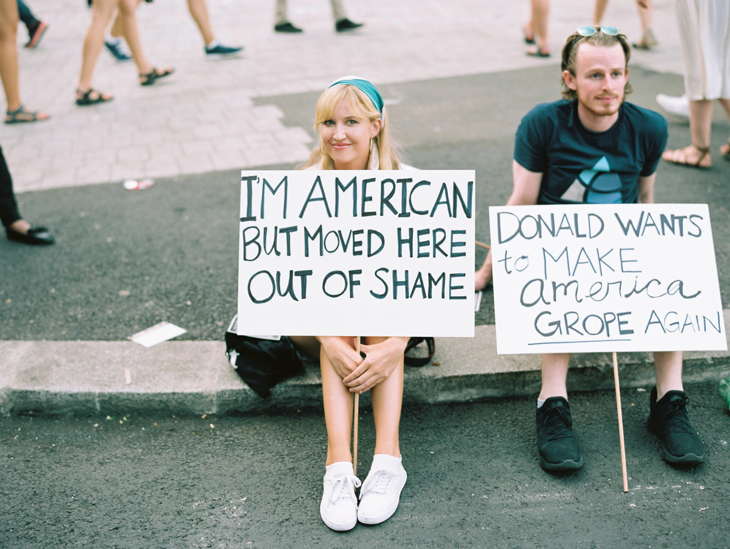 American lady holding placard at London Trump protest