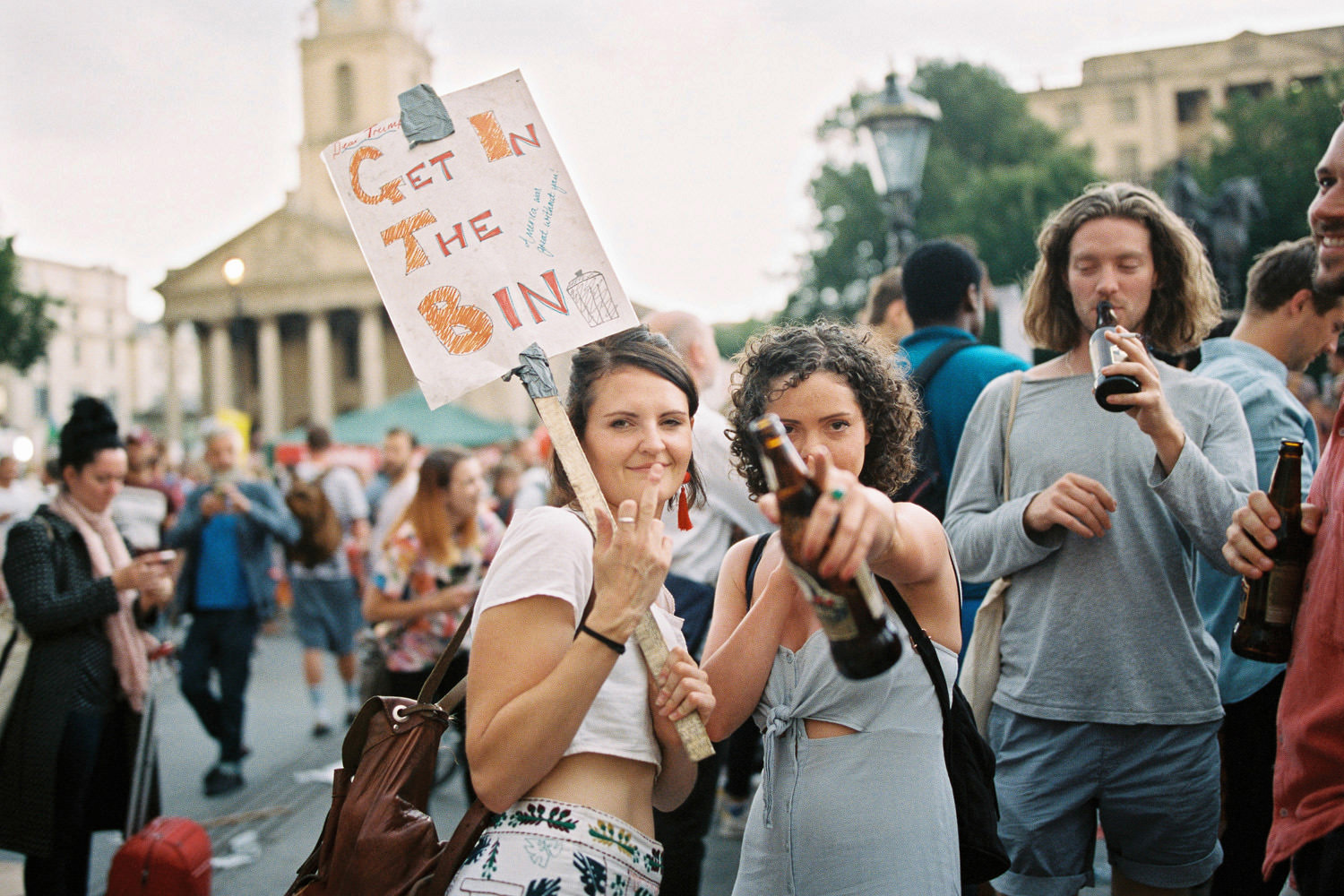Two woman with placards at rally