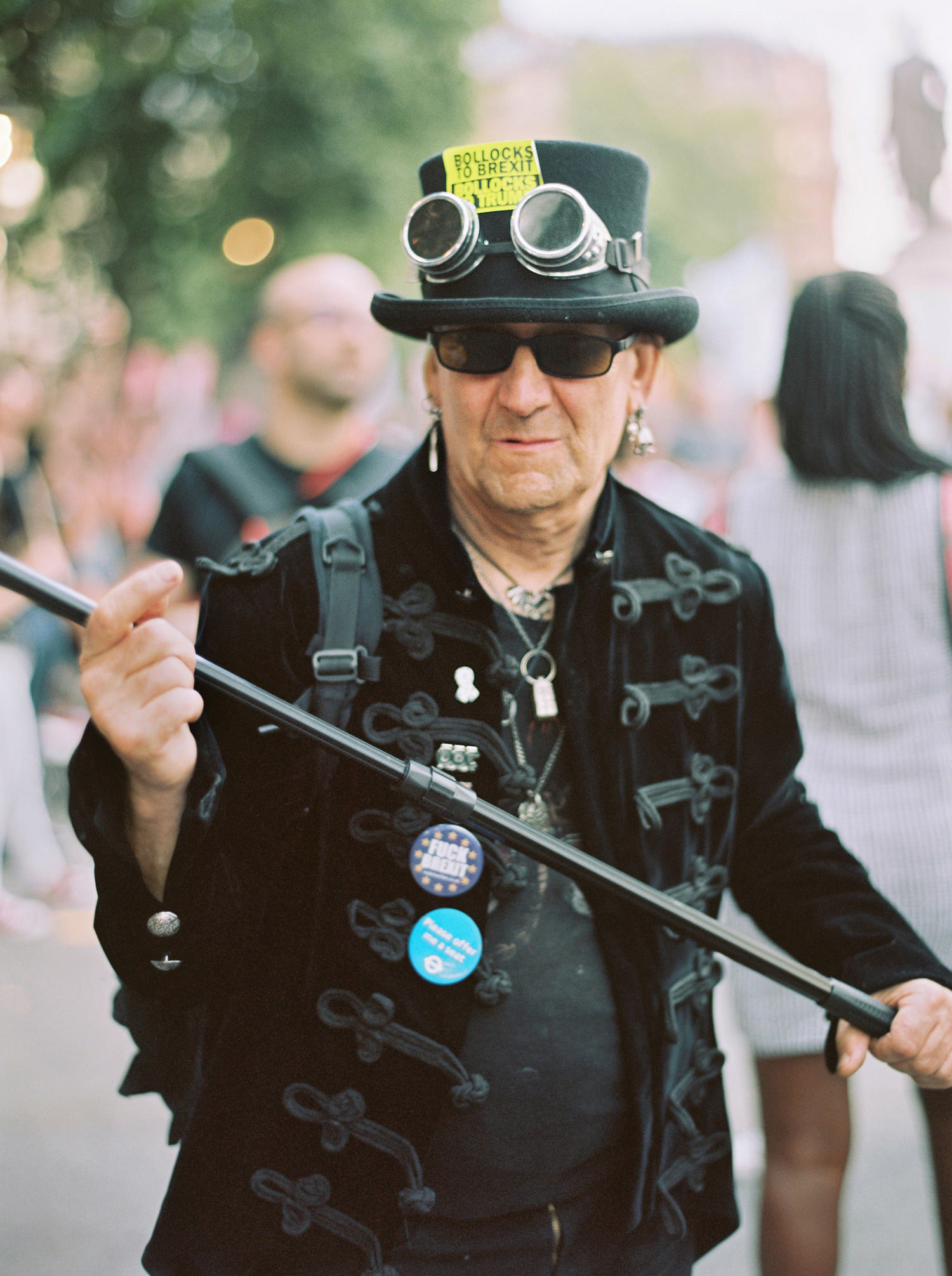 Man at London Trump protest in top hat and goggles