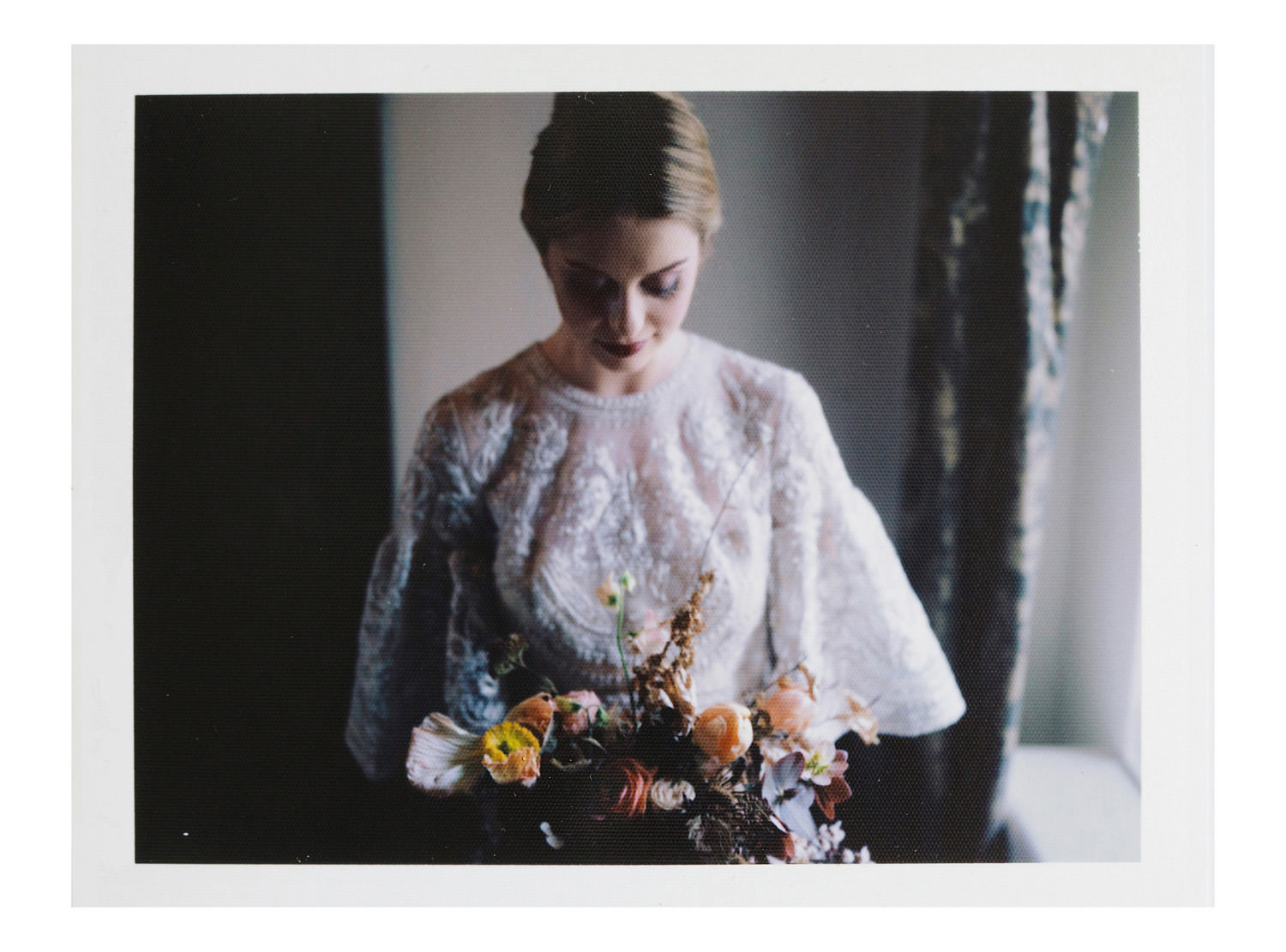 polaroid of bride holding bouquet from Fiona Perry Flowers