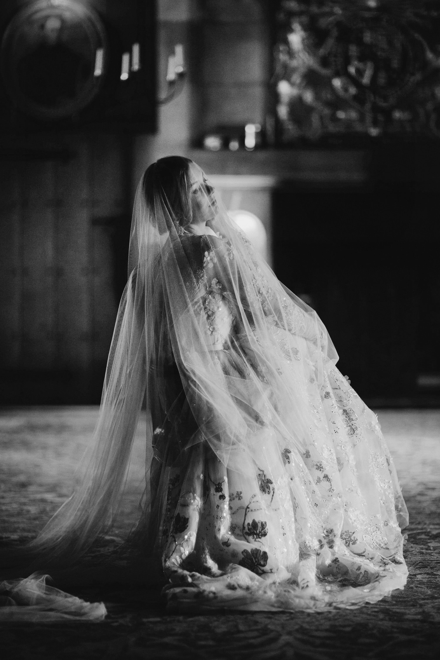 bride sitting with long veil covering her at Hilles House wedding venue