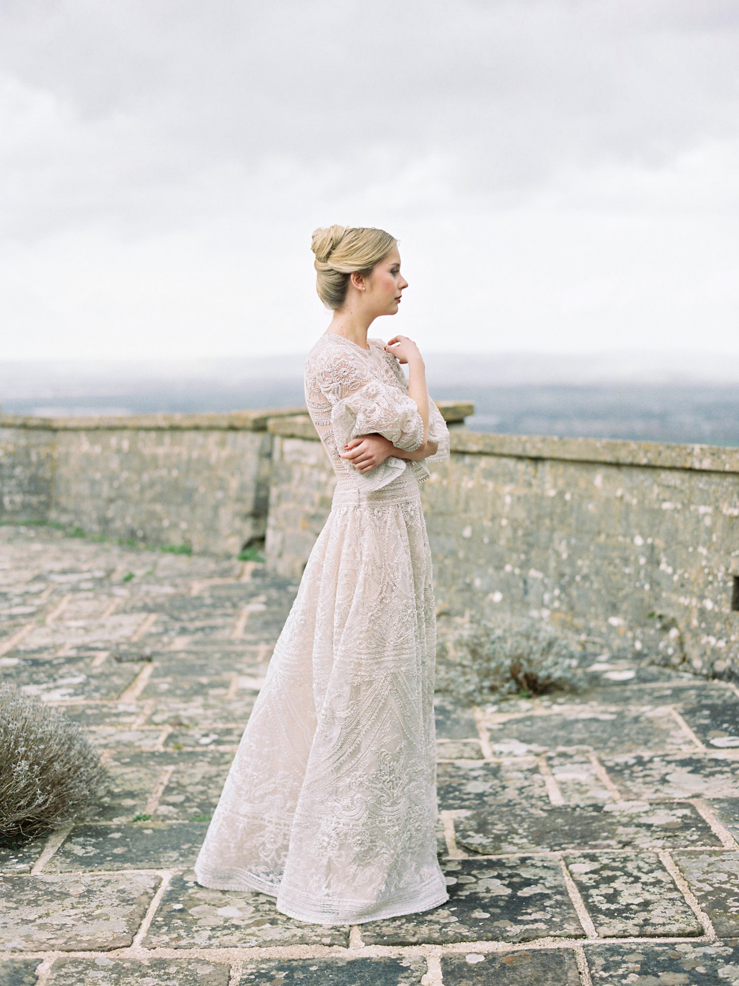 bride standing on terrace at Hilles House in front of brilliant views