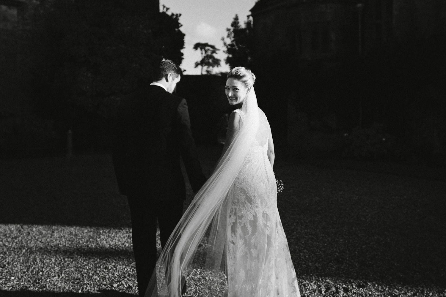Bride and Groom walking in winter light at a Brympton House wedding