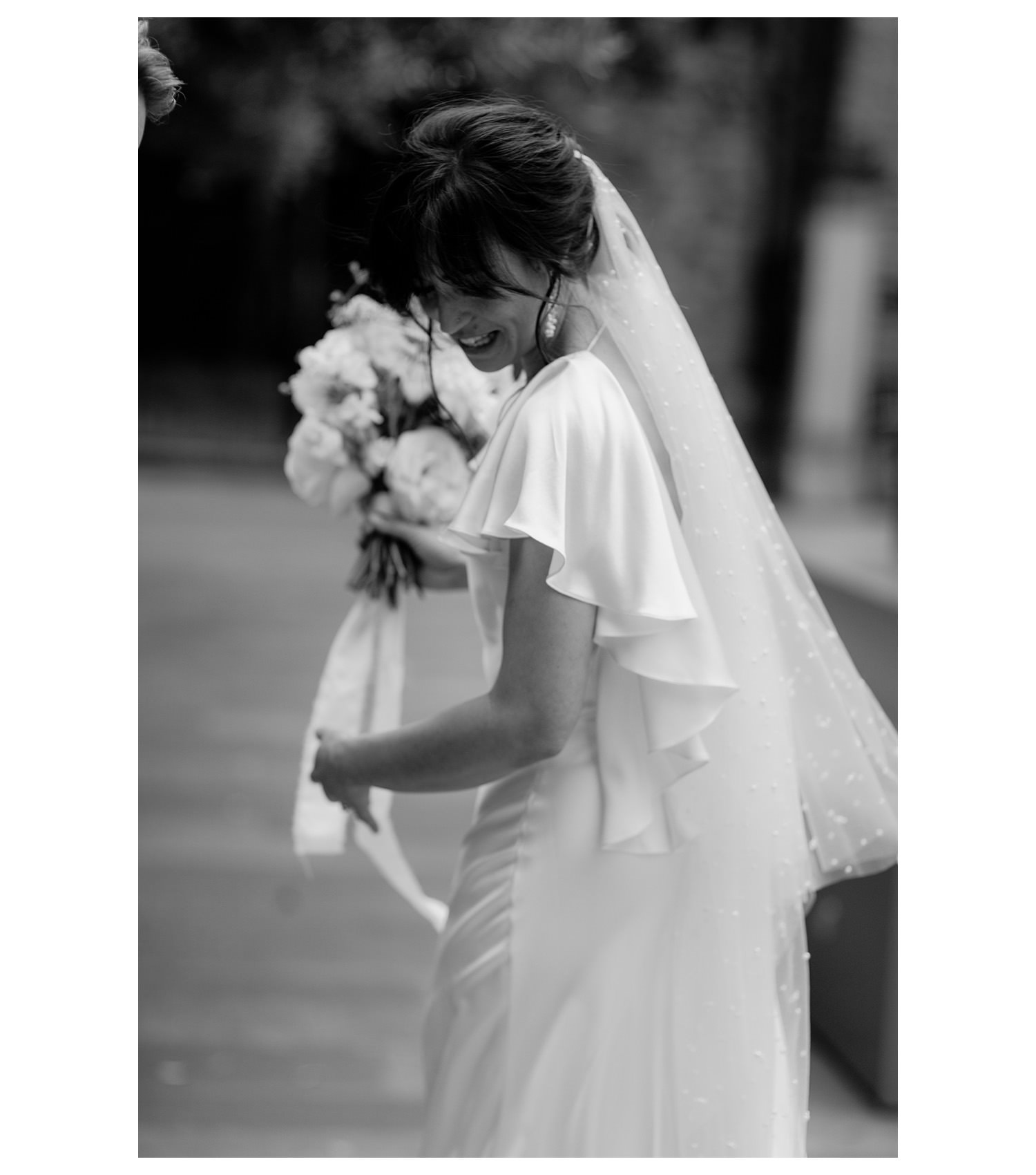 bride looking back in a beautiful flowing dress.